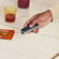 Hand holding Ploom device with Navy Blue Back Cover