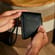 Hand holding a Ploom Duo Carry Case Jet Black accessory