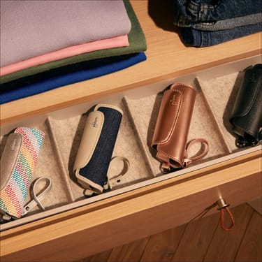 Collection of Ploom AURA Solo Carry Cases inside a drawer