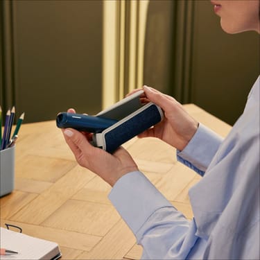 User opening a Ploom Solo Carry Case Denim Leather Fusion accessory