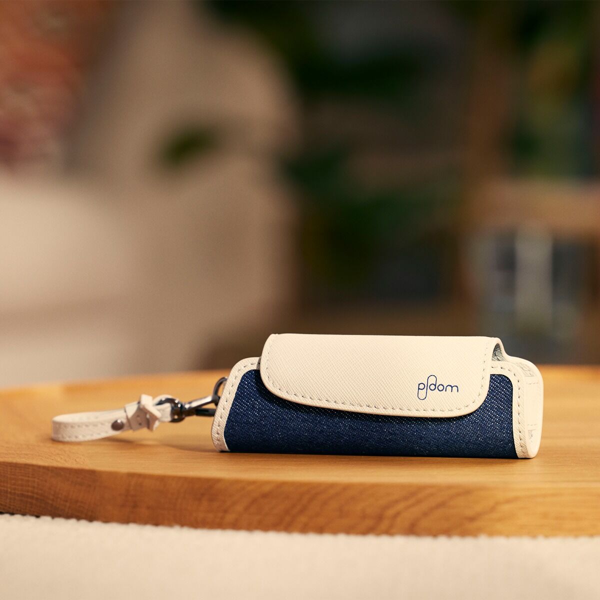 Ploom Aura Denim Leather Fusion Solo Carry Case accessory on a table